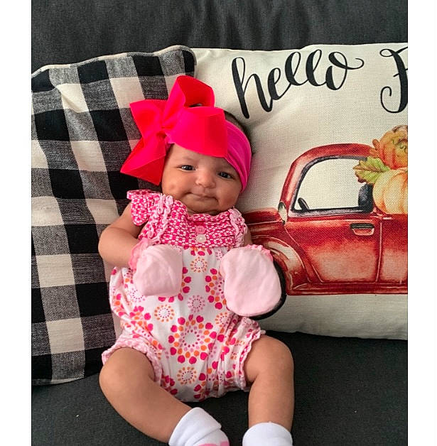 Alyssia is registered to the contest to win money with this photo: baby, baby_toddler_clothing, bag, beauty, cap, child, fashion_accessory, font, happy, headwear, linens, magenta, pattern, person, pink, product, rectangle, sleeve, t_shirt, textile