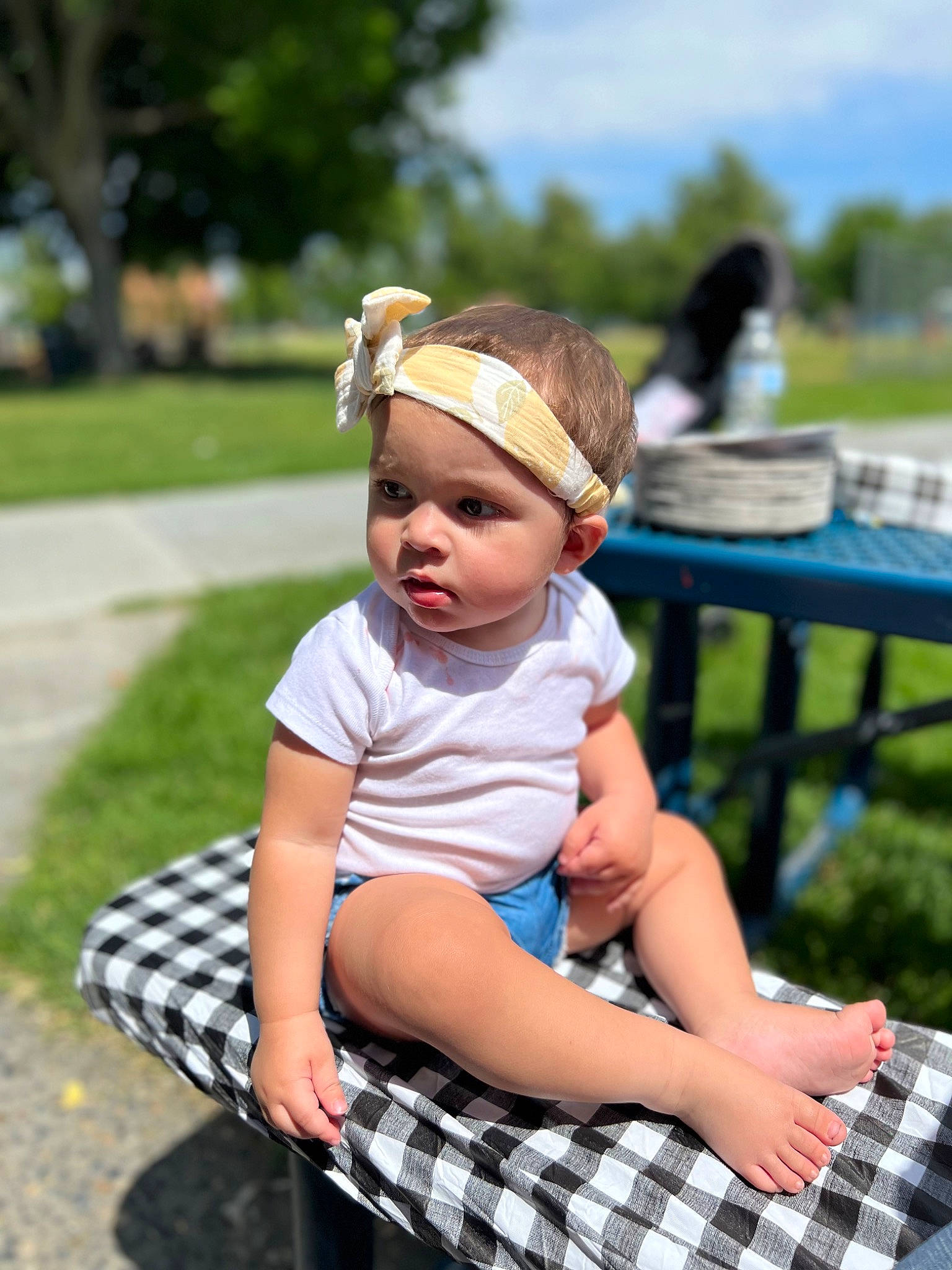 Sanya is registered to the contest to win money with this photo: baby_toddler_clothing, child, cloud, flash_photography, fun, grass, happy, hat, headgear, headwear, leisure, person, plaid, plant, recreation, shorts, sky, summer, tartan, thigh