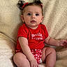 baby, infant, child, red_clothing, pigtails, bows, sitting, blanket, soft_texture, cute, portrait, indoors, skin, legs, hand, face, eyes, mouth, expression, smile_society