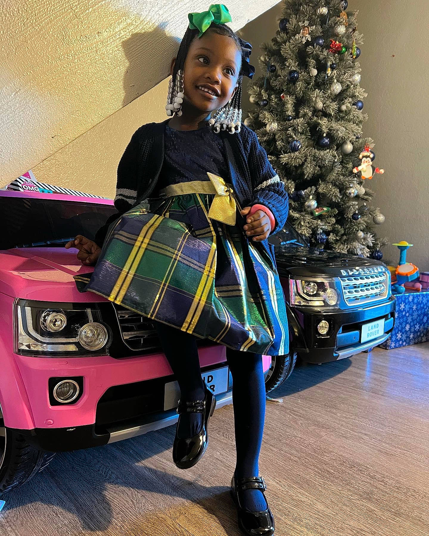 Samyah is registered to the contest to win money with this photo: automotive_design, blue, christmas_decoration, christmas_ornament, christmas_tree, electric_blue, entertainment, event, fashion_design, fun, holiday, joy, pattern, person, plaid, shoe, tartan, textile, tire, toddler