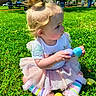 toddler, child, grass, park, toy, plastic_eggs, tutu, rainbow_leggings, pony_tail, outdoor, sunny, people, trees, playing, cute, sitting, colorful, daytime, young_child, nature
