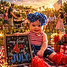 baby, child, 4th_of_july, patriotic, celebration, fireworks, picnic_blanket, american_flag, sparkler, summer, outdoor, party, family, holiday, dress, headband, flowers, grill, people, smiling