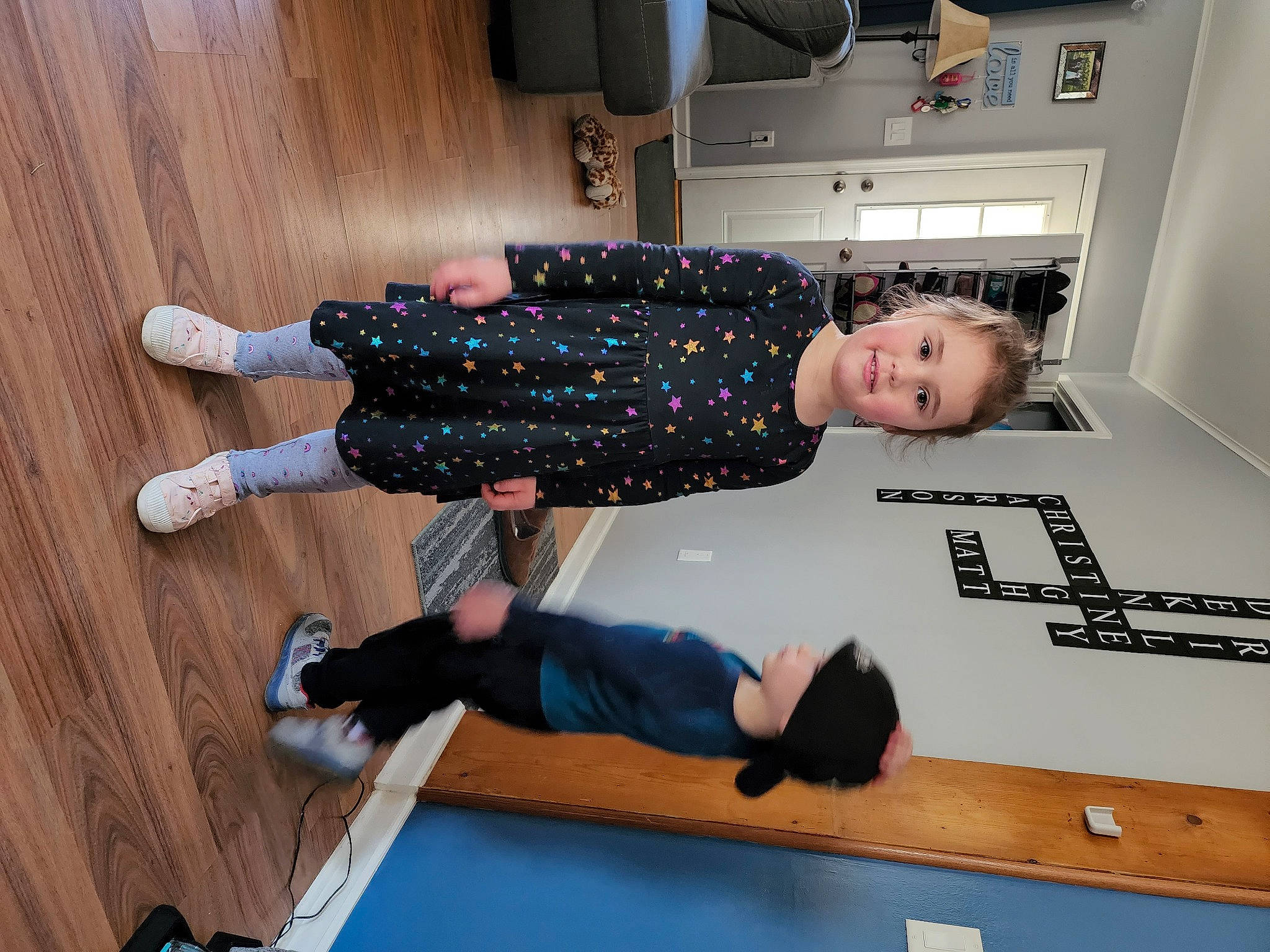 Riley joined the competition — help win amazing prizes! active_pants, balance, comfort, elbow, floor, flooring, fun, hardwood, human_leg, joint, knee, person, room, sleeve, sock, sportswear, t_shirt, thigh, walking_shoe, wood