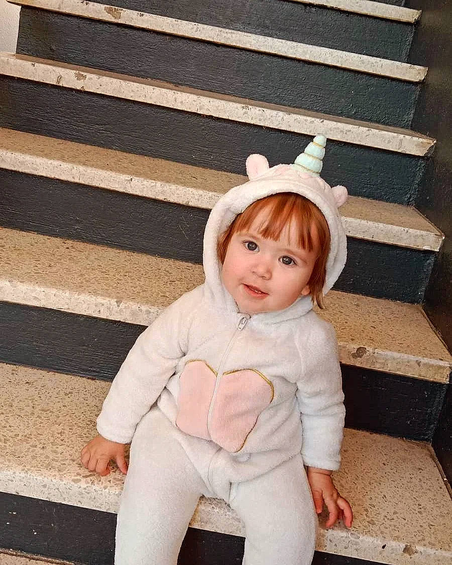 Lena participe au concours pour gagner de l'argent avec cette photo : baby_toddler_clothing, beauty, child, design, face, fashion_accessory, fun, fur, gesture, happy, headgear, organ, pattern, peach, person, photograph, sitting, sleeve, smile, toddler