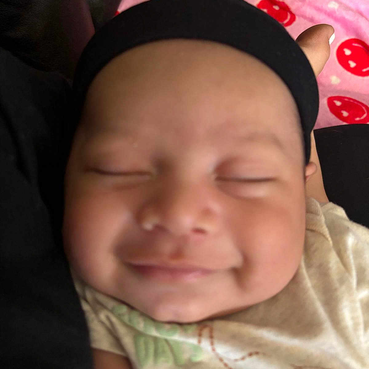 Noah joined the competition — help win amazing prizes! apparel, baby, blanket, child, closeup, comfort, cute, face, headband, indoors, infant, person, pink, portrait, red, resting, sleeping, smiling, soft, young