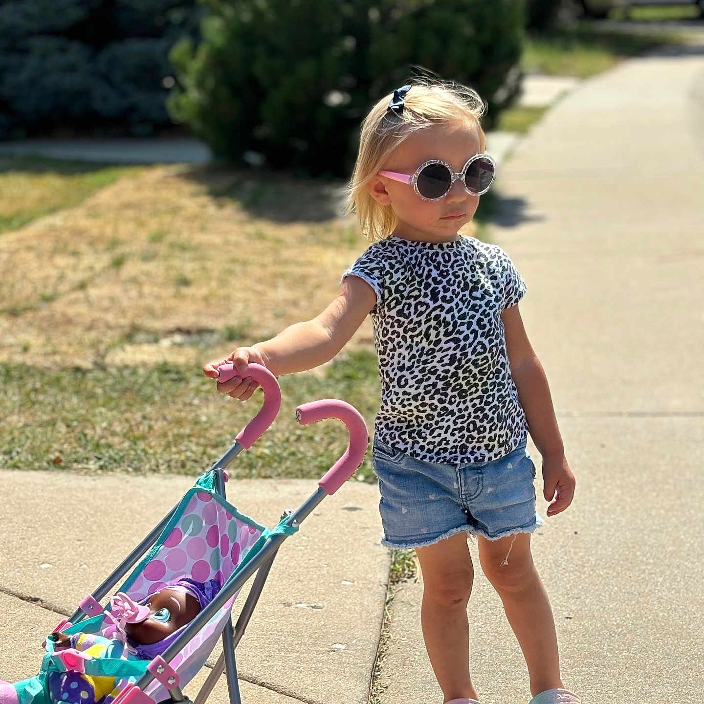 Sofía joined the competition — help win amazing prizes! accessories, baby, child, city, clothing, face, female, girl, grass, head, path, person, photography, portrait, road, shorts, street, sunglasses, urban, walking