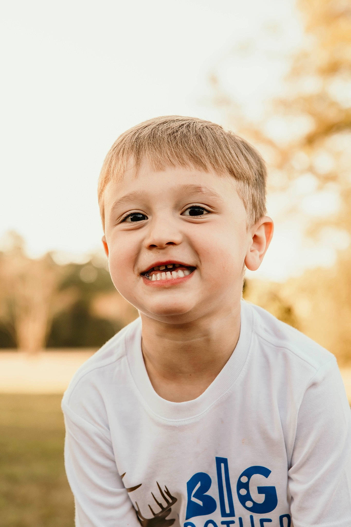 Preston is registered to the contest to win money with this photo: blond, cheek, child, flash_photography, fun, grass, happy, joy, laugh, leisure, lip, people_in_nature, person, plant, sitting, sleeve, smile, standing, t_shirt, toddler