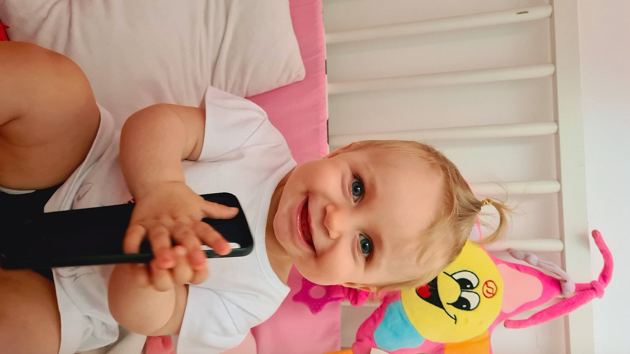 Brianna participe au concours pour gagner de l'argent avec cette photo : arm, baby, baby_toddler_clothing, cheek, comfort, dress, eye, facial_expression, finger, gesture, happy, head, human_body, joy, mouth, neck, nose, person, pink, skin