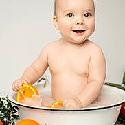 Fabio participe au concours pour gagner de l'argent avec cette photo : baby, basin, bath, child, citrus, cute, fresh, fruit, greenery, happy, indoor, milky, naked, orange, playful, sitting, skin, smiling, water, young