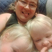 Sawyer And Sophia is registered to the contest to win money with this photo: child, toddler, adult, person, selfie, couch, blanket, glasses, smile, tongue_out, closeup, indoor, family, blurriness, cozy, hair, cheek, playful, portrait, sitting
