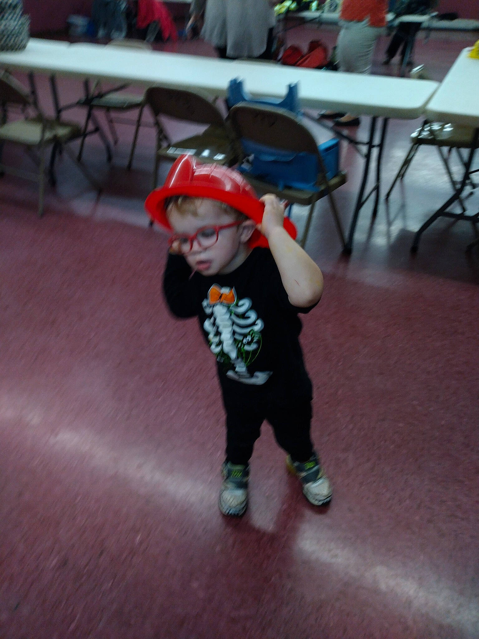 Sheldon joined the competition — help win amazing prizes! baby, baseball_cap, chair, child, costume, entertainment, event, fictional_character, floor, flooring, fun, hat, leisure, person, personal_protective_equipment, recreation, sitting, t_shirt, table, toddler