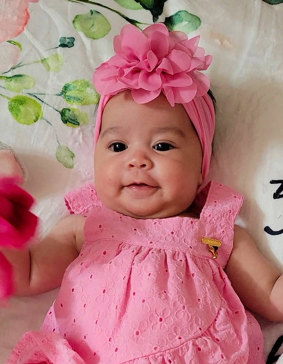 Lucia joined the competition — help win amazing prizes! baby, baby_products, baby_toddler_clothing, cap, cheek, child, dress, fashion_accessory, happy, headband, headpiece, headwear, magenta, peach, person, petal, pink, skin, sleeve, smile