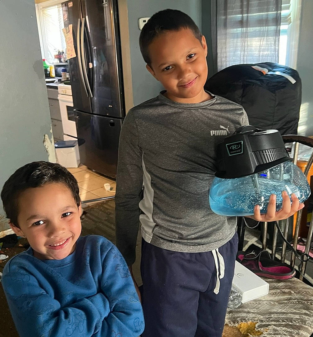 Torian Jr. is registered to the contest to win money with this photo: child, cool, flooring, hairstyle, happy, joint, joy, machine, muscle, person, personal_protective_equipment, room, shelf, shorts, shoulder, sleeve, smile, sportswear, standing, t_shirt