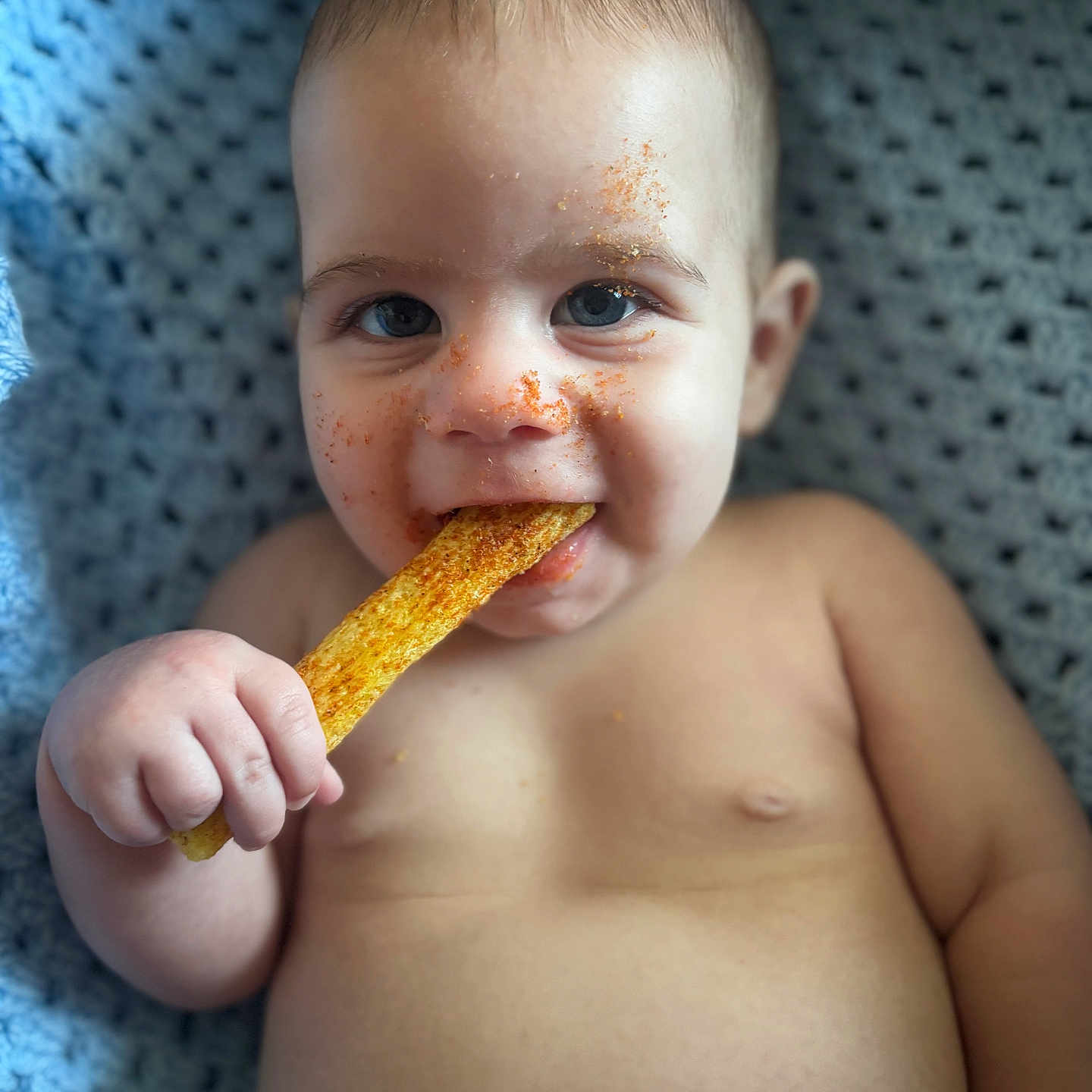Tommy is registered to the contest to win money with this photo: baby, biting, bodypart, cream, cutlery, dessert, eating, face, finger, food, hand, head, icecream, person, photography, portrait, spoon