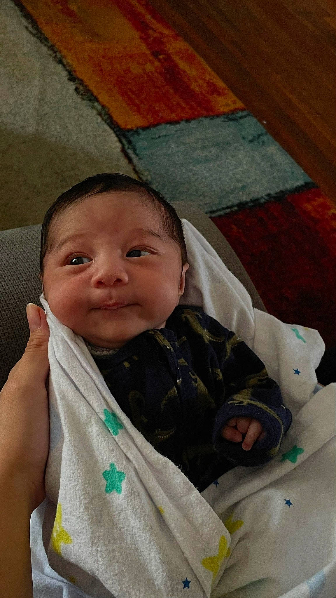 Isaiah is registered to the contest to win money with this photo: baby, baby_products, baby_toddler_clothing, cheek, child, comfort, eye, eyebrow, happy, head, iris, linens, person, room, sitting, skin, sleeve, smile, thumb, toddler