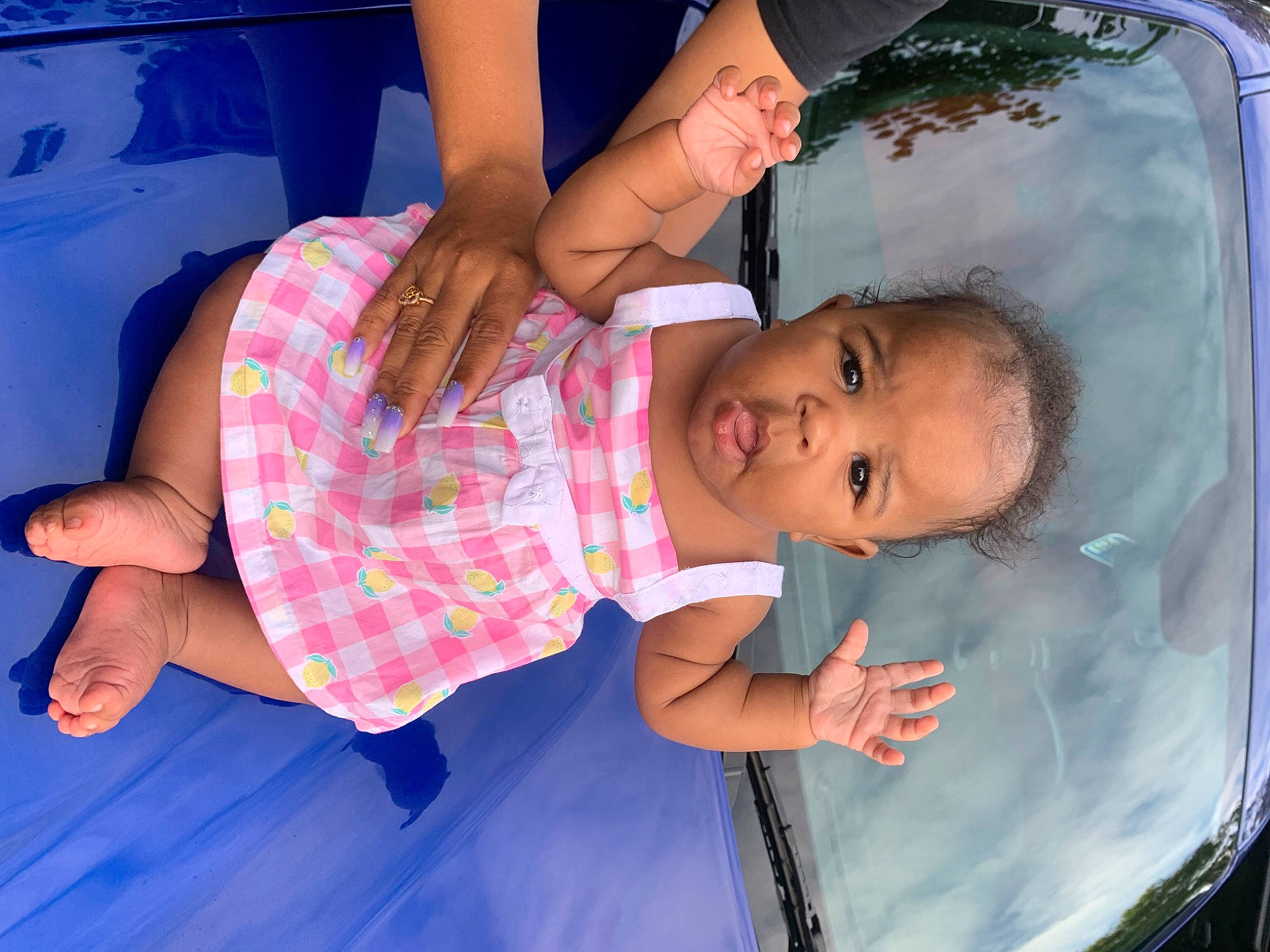 Amiya is registered to the contest to win money with this photo: arm, azure, baby, blue, facial_expression, finger, fun, gesture, hand, happy, human, joint, leisure, mouth, muscle, person, pink, skin, summer, toddler
