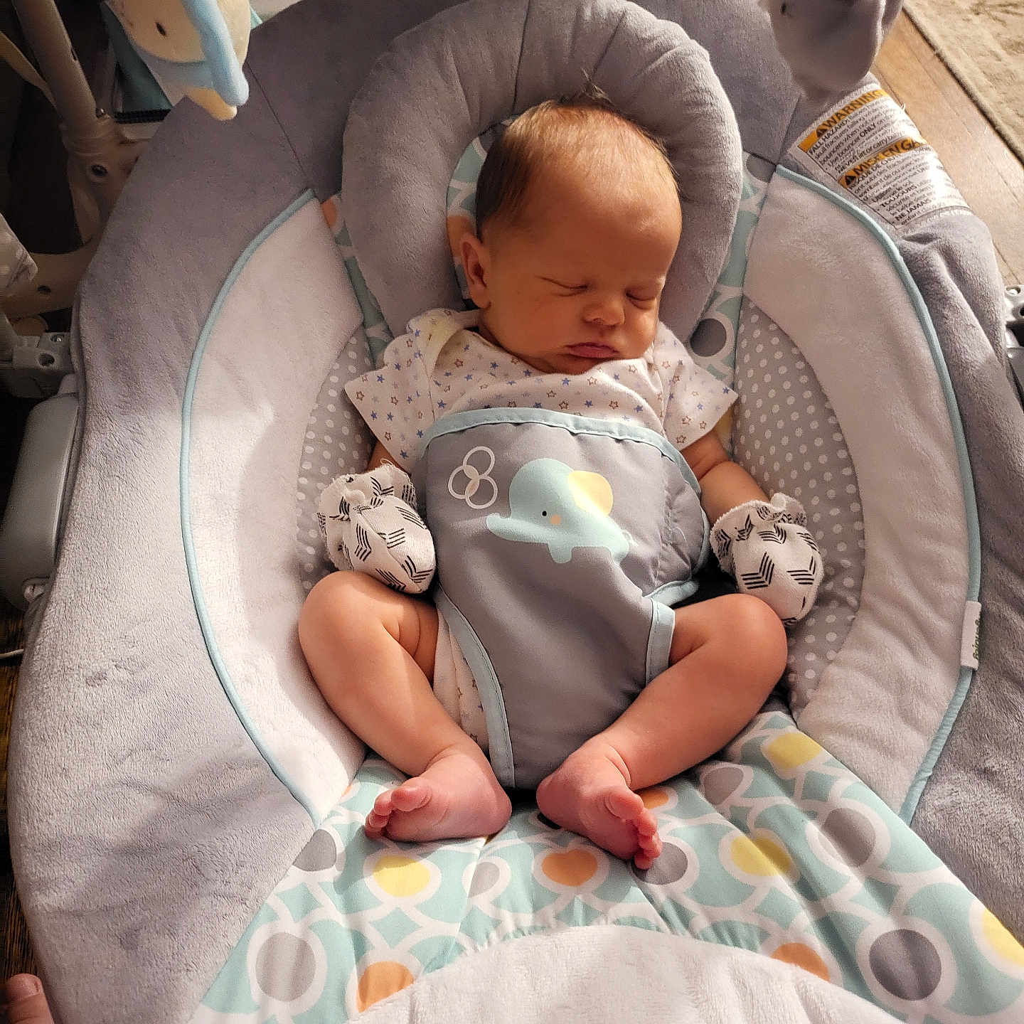 Kaiden is registered to the contest to win money with this photo: americanfootball, americanfootballball, baby, ball, bed, blanket, cradle, crib, cushion, face, football, furniture, head, homedecor, infantbed, newborn, person, photography, portrait, sport