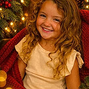 Melina participe au concours pour gagner de l'argent avec cette photo : blanket, bokeh, celebration, child, christmas_lights, christmas_tree, cozy, curly_hair, decorations, festive, girl, green, happy, holiday, indoors, portrait, red, seasonal, smiling, toddler
