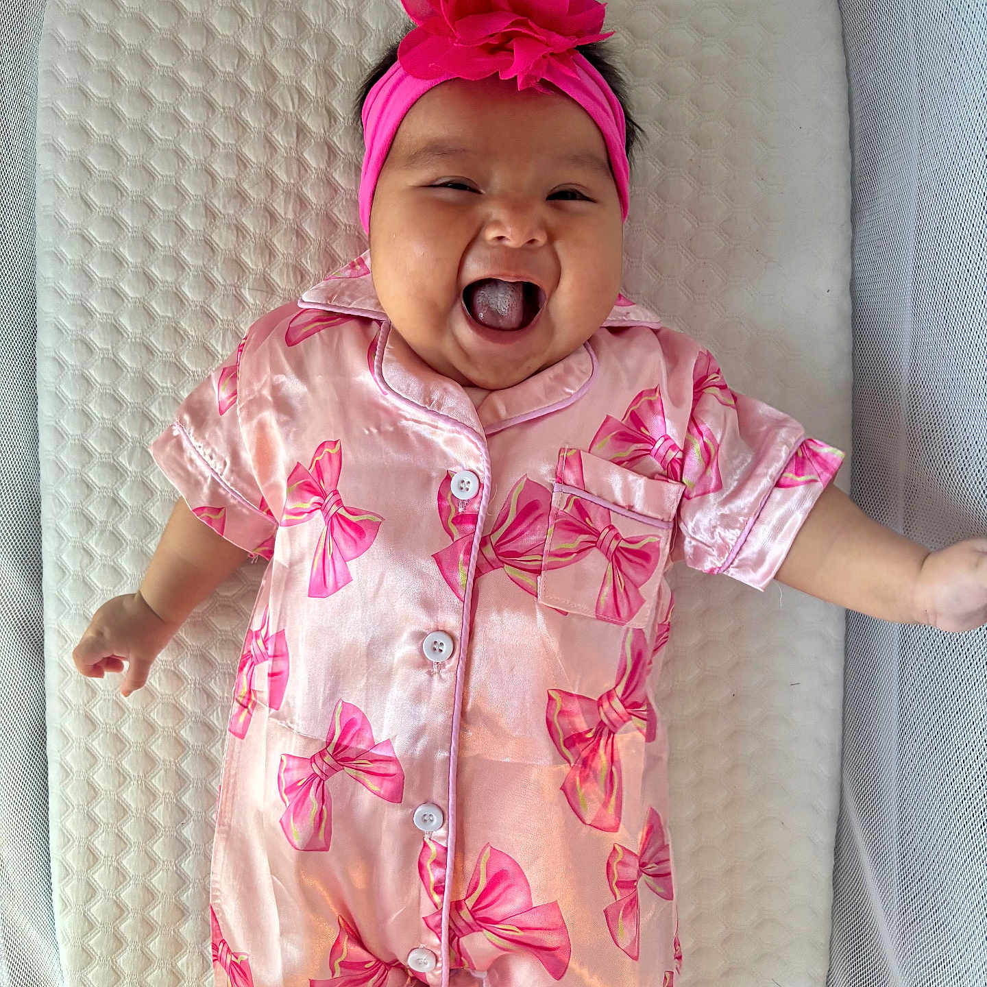 Brixlei joined the competition — help win amazing prizes! baby, child, cushion, cute, flower, happy, headband, indoors, infant, laughing, lying_down, newborn, one_person, pink_outfit, playful, portrait, sleepsuit, smiling, soft_lighting, textured_background