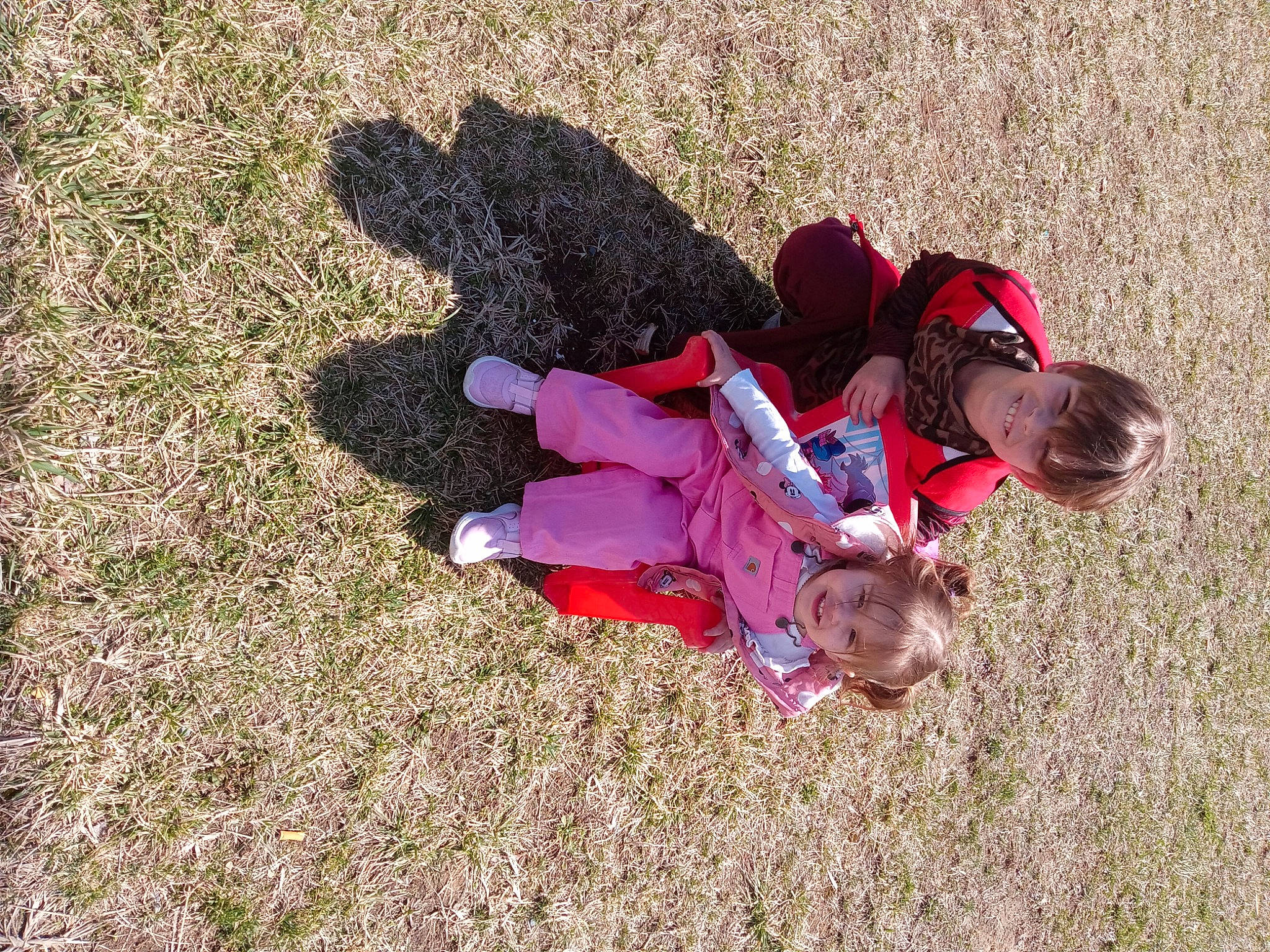 Logan joined the competition — help win amazing prizes! baby_toddler_clothing, child, fun, grass, grassland, happy, joy, leisure, magenta, people_in_nature, person, plant, play, recreation, sand, shadow, sitting, soil, tints_and_shades, toddler