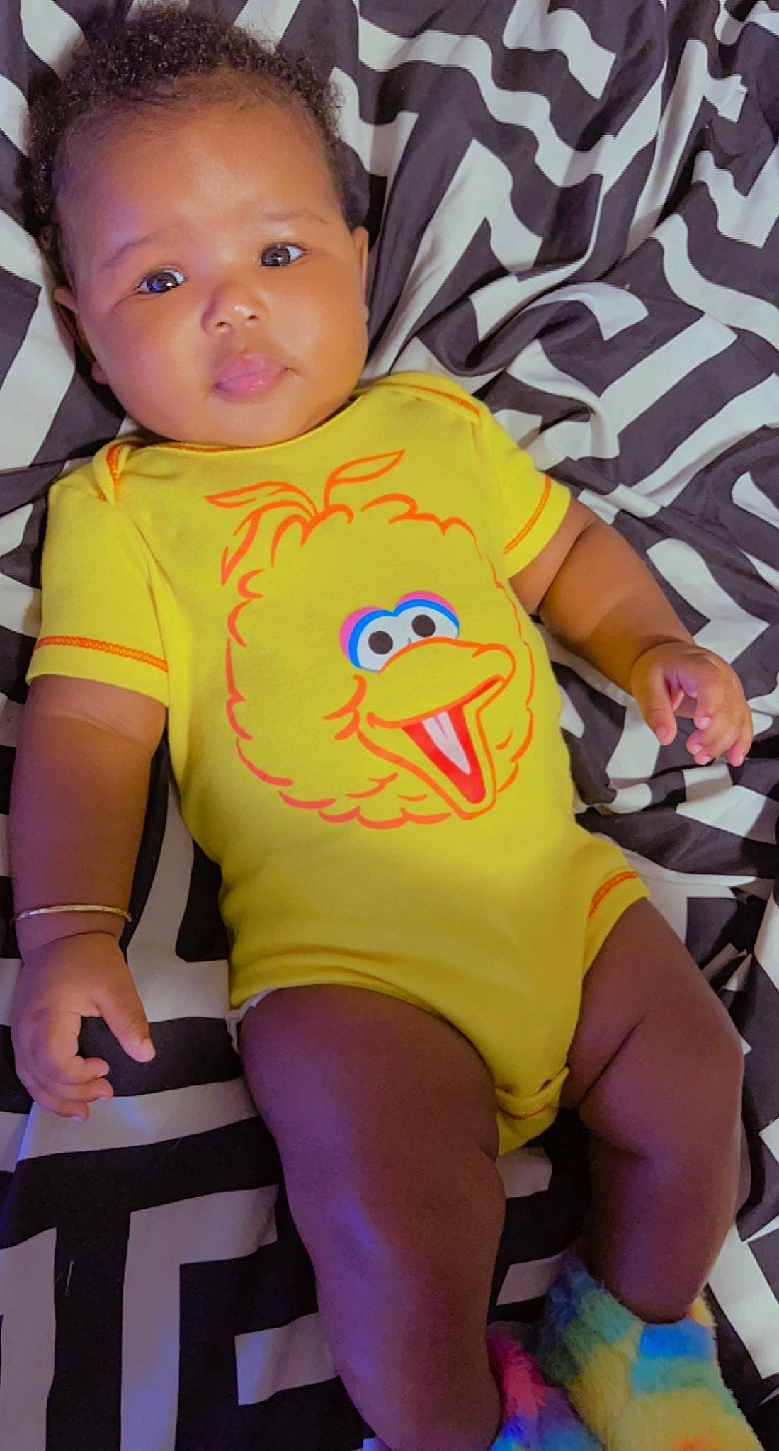 Gianna is registered to the contest to win money with this photo: baby_toddler_clothing, black, child, cool, elbow, eye, facial_expression, finger, fun, happy, human_leg, joint, mouth, person, pink, skin, sleeve, t_shirt, thigh, thumb