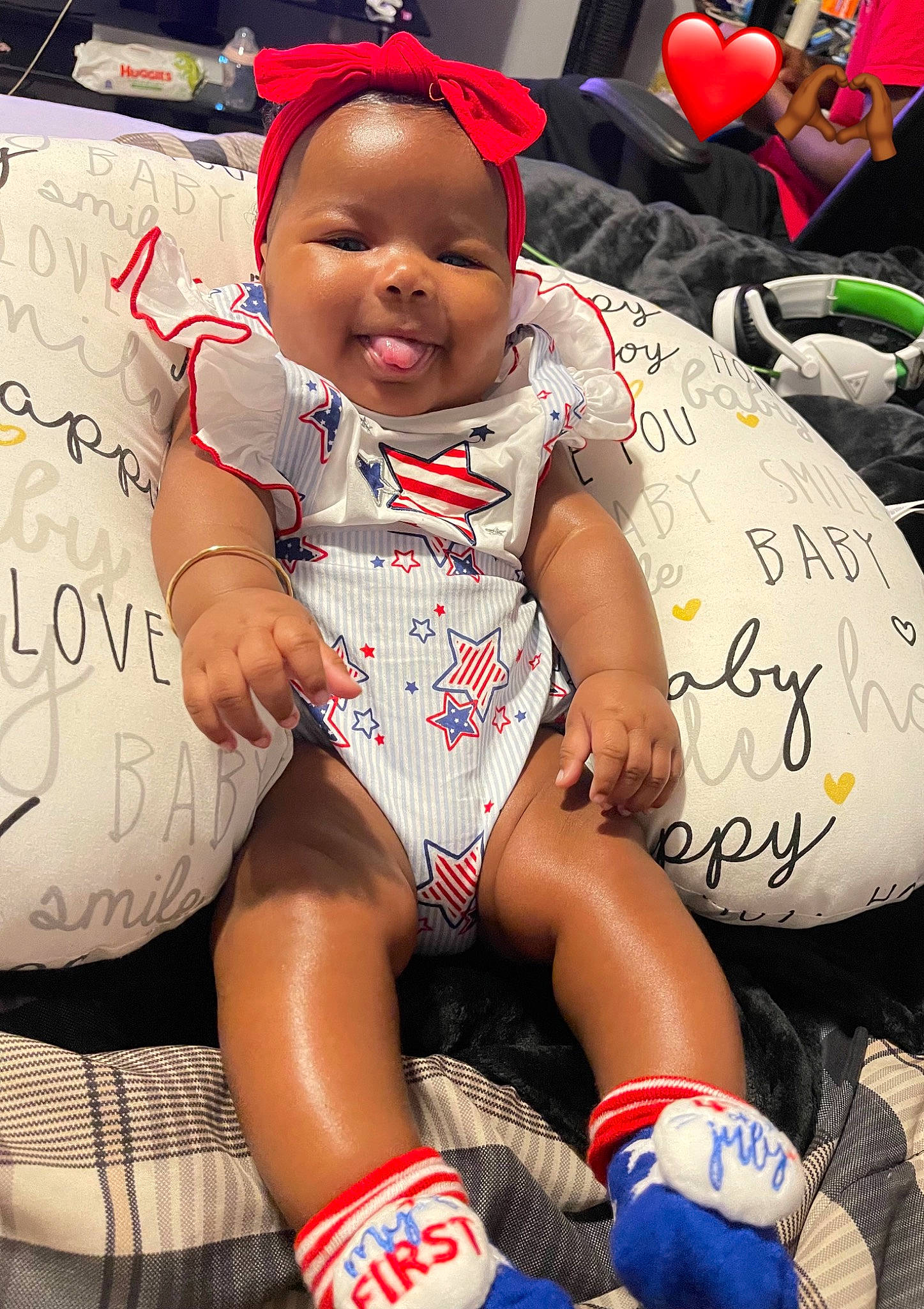 Gianna joined the competition — help win amazing prizes! baby, baby_toddler_clothing, carmine, child, event, fashion_accessory, finger, fun, happy, headgear, human_leg, knee, necklace, person, personal_protective_equipment, red, sitting, smile, thigh, toddler