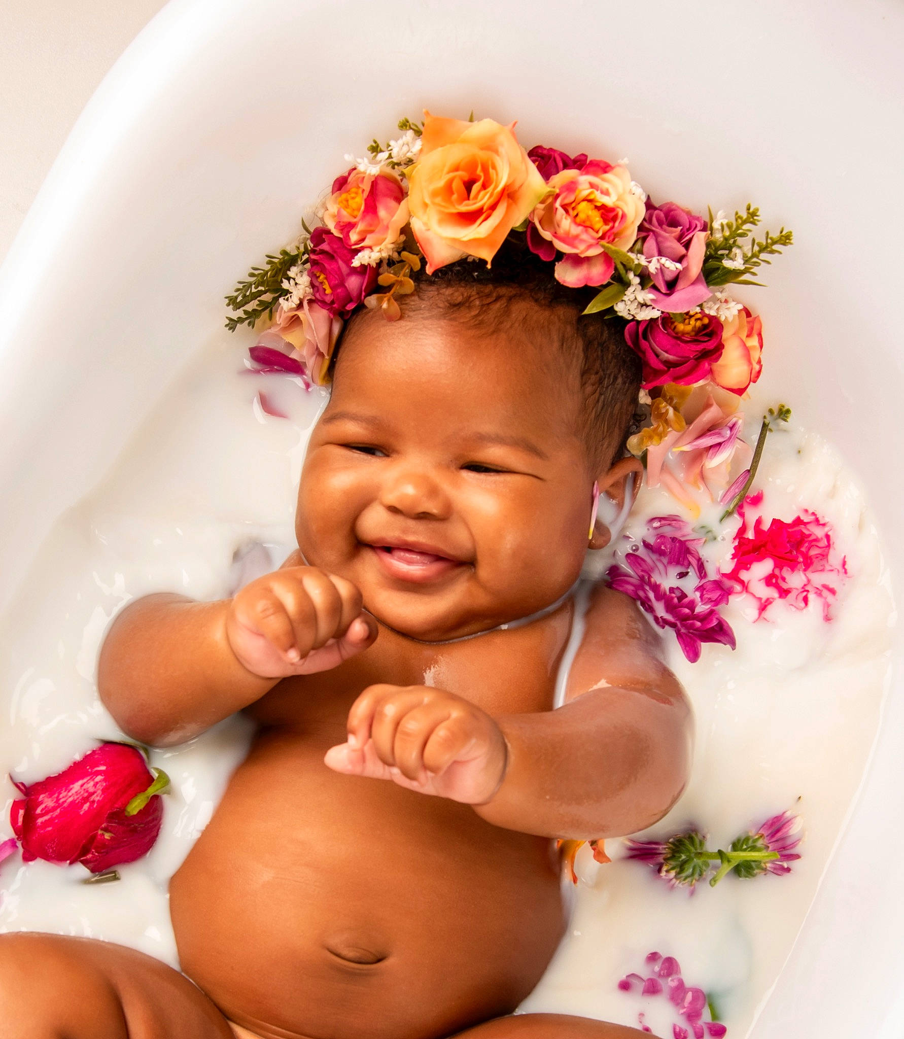 Gianna is registered to the contest to win money with this photo: abdomen, arm, baby, chest, face, finger, flower, gesture, hand, happy, head, jewellery, joy, lip, nail, person, petal, pink, skin, smile