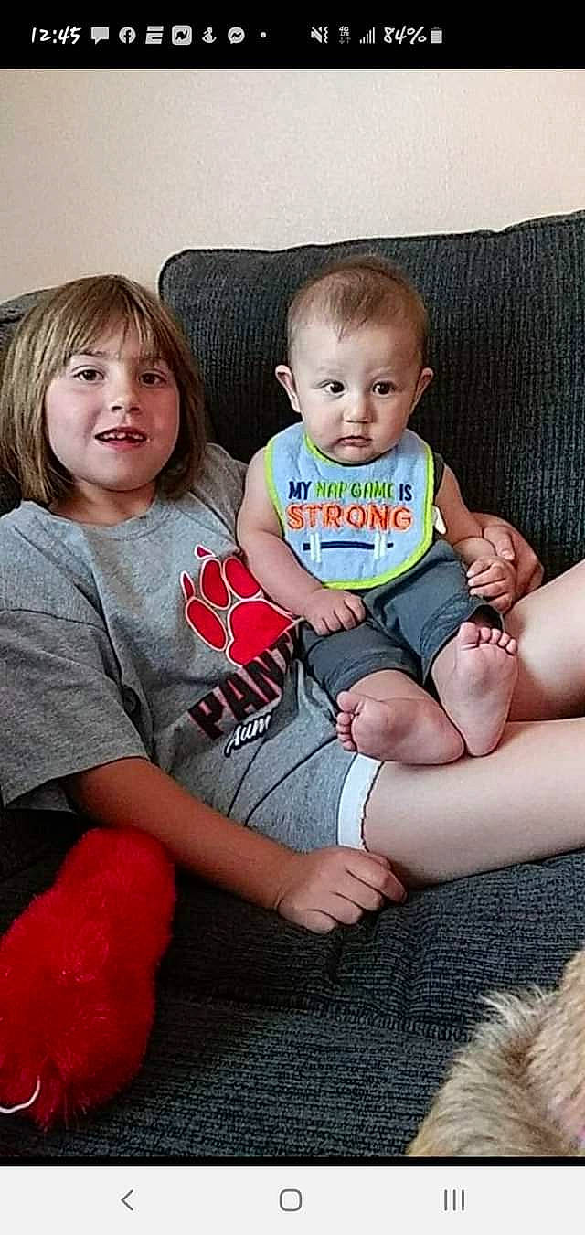 Avalee joined the competition — help win amazing prizes! arm, baby_toddler_clothing, cheek, couch, eye, face, facial_expression, finger, happy, head, human, human_body, interaction, iris, leg, person, pink, skin, sleeve, standing