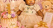 Ava is registered to the contest to win money with this photo: baby, child, birthday, cake, balloons, gift, present, flower, dress, celebration, party, pink, gold, teddy_bear, ribbon, smile, portrait, decor, cute, festive