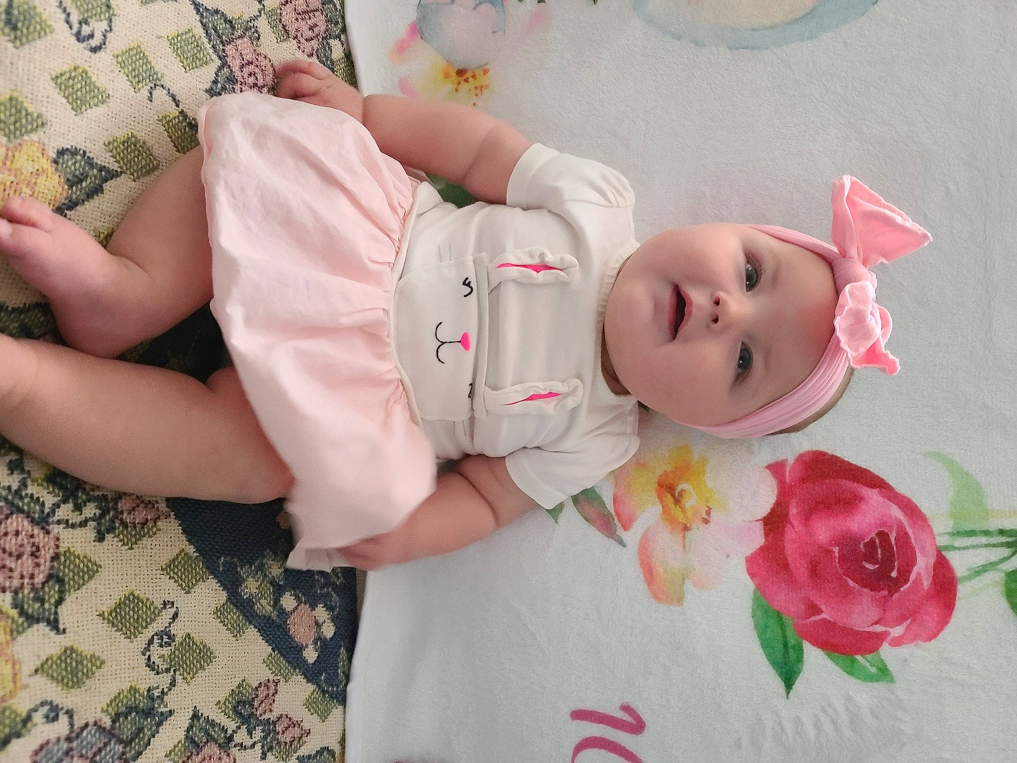 Rylee is registered to the contest to win money with this photo: baby, baby_products, baby_toddler_clothing, cheek, child, comfort, eye, face, flower, happy, hat, headgear, headwear, person, petal, pink, plant, rose, skin, sleeve
