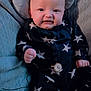 Marley joined the competition — help win amazing prizes! baby, infant, star_pattern, onesie, plush_pillow, knit_blanket, blue, cute, face, smile, hand, fist, comfort, indoors, child, portrait, soft_toys, clothing, relaxing, young