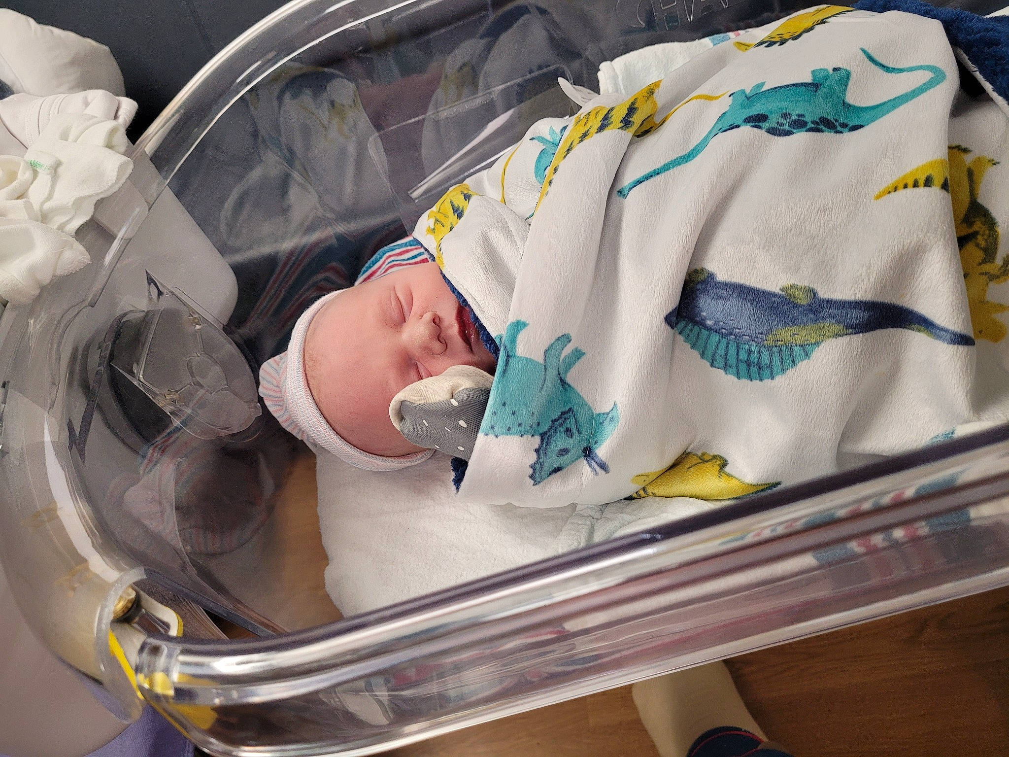 Kenneth is registered to the contest to win money with this photo: baby, baby_carriage, baby_products, baby_safety, baby_toddler_clothing, child, comfort, health_care, infant_bed, linens, medical_equipment, person, plastic, product, room, service, sleeve, toddler