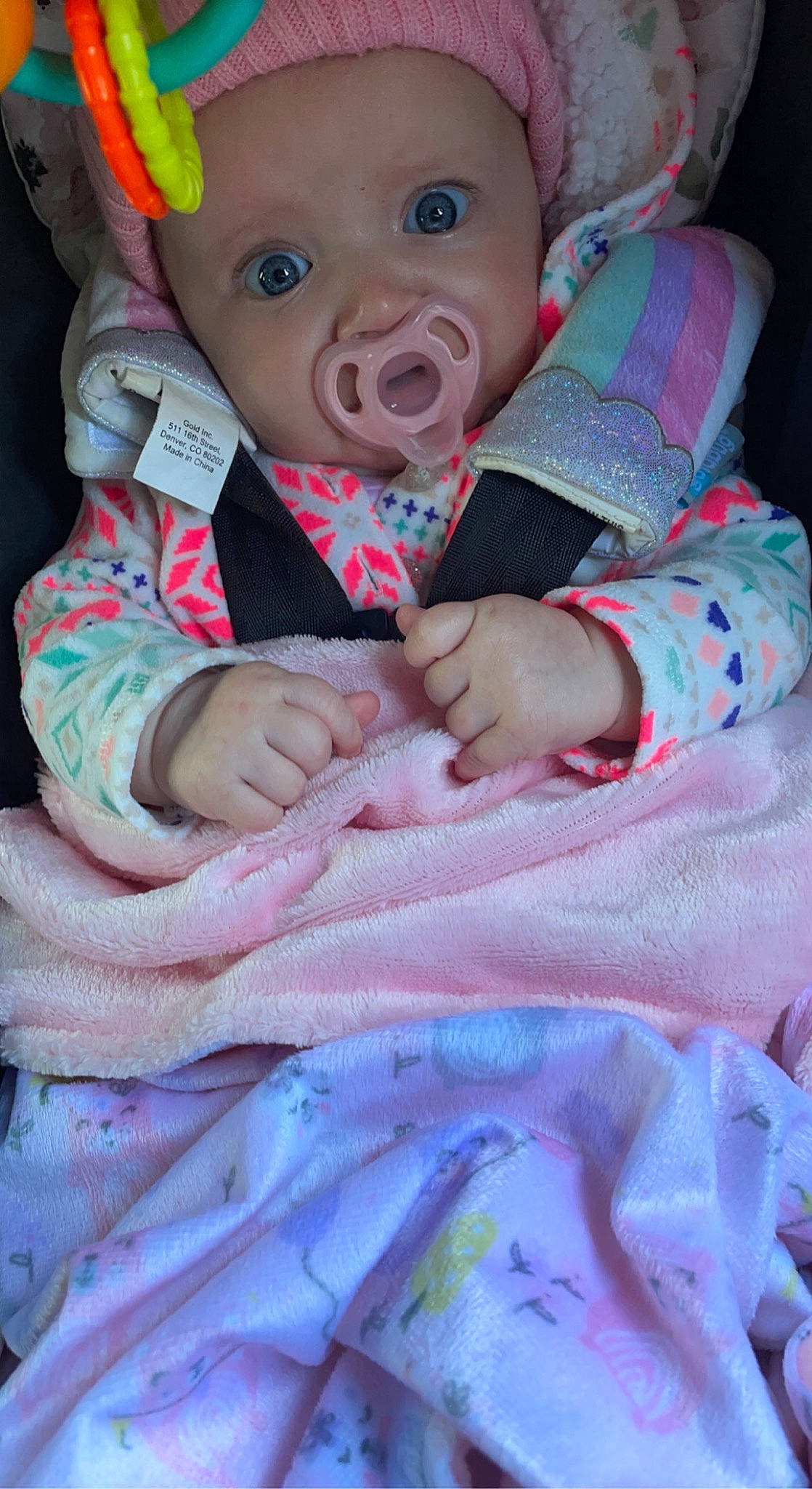 Haylee joined the competition — help win amazing prizes! baby, baby_products, baby_safety, baby_toddler_clothing, baby_toys, cheek, child, comfort, eyelash, happy, headwear, infant_bed, iris, linens, magenta, pattern, person, pink, skin, textile