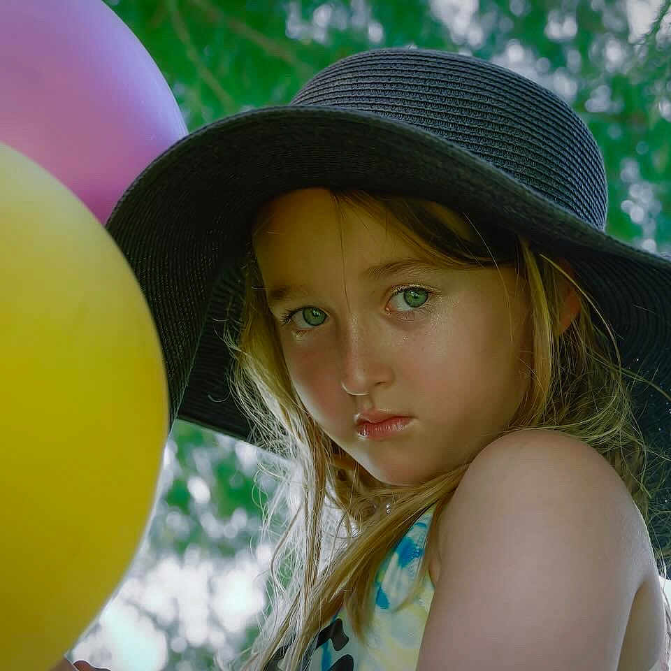 Scarlett Rose is registered to the contest to win money with this photo: adult, balloon, cap, clothing, costume, cowboyhat, face, female, happy, hat, head, lady, person, photography, portrait, purple, selfie, smile, sunhat, woman