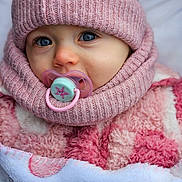 Nora participe au concours pour gagner de l'argent avec cette photo : baby, beanie, blanket, blue_eyes, bundled_up, cheeks, child, close_up, cozy, cute, eyelashes, infant, knit_hat, pacifier, pink_clothing, pink_hat, portrait, scarf, soft_texture, winter_clothing