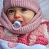baby, beanie, blanket, blue_eyes, bundled_up, cheeks, child, close_up, cozy, cute, eyelashes, infant, knit_hat, pacifier, pink_clothing, pink_hat, portrait, scarf, soft_texture, winter_clothing
