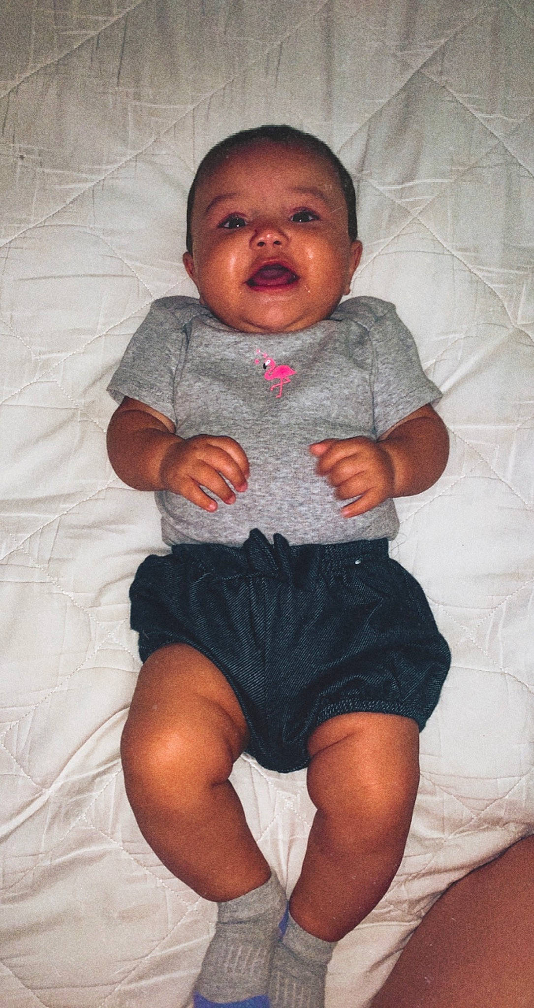 Isabella is registered to the contest to win money with this photo: arm, baby_toddler_clothing, cheek, chin, clothing, comfort, eye, face, hair, hairstyle, hand, head, human_body, leg, mouth, neck, nose, person, skin, stomach