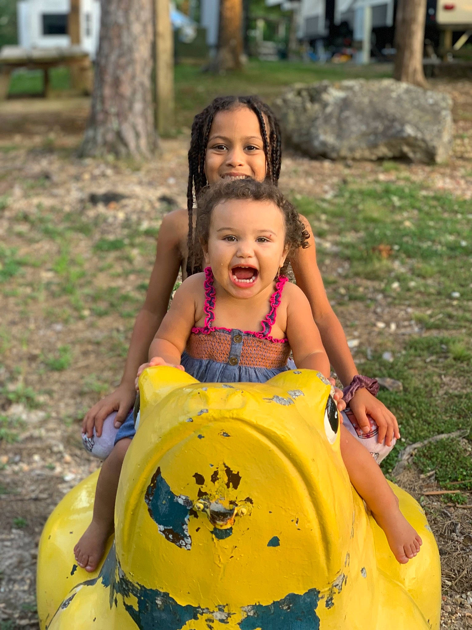 Isabella is registered to the contest to win money with this photo: child, dress, event, eye, face, fun, grass, happy, joy, leisure, outdoor_play_equipment, people_in_nature, person, plant, playground, recreation, skin, smile, summer, toddler