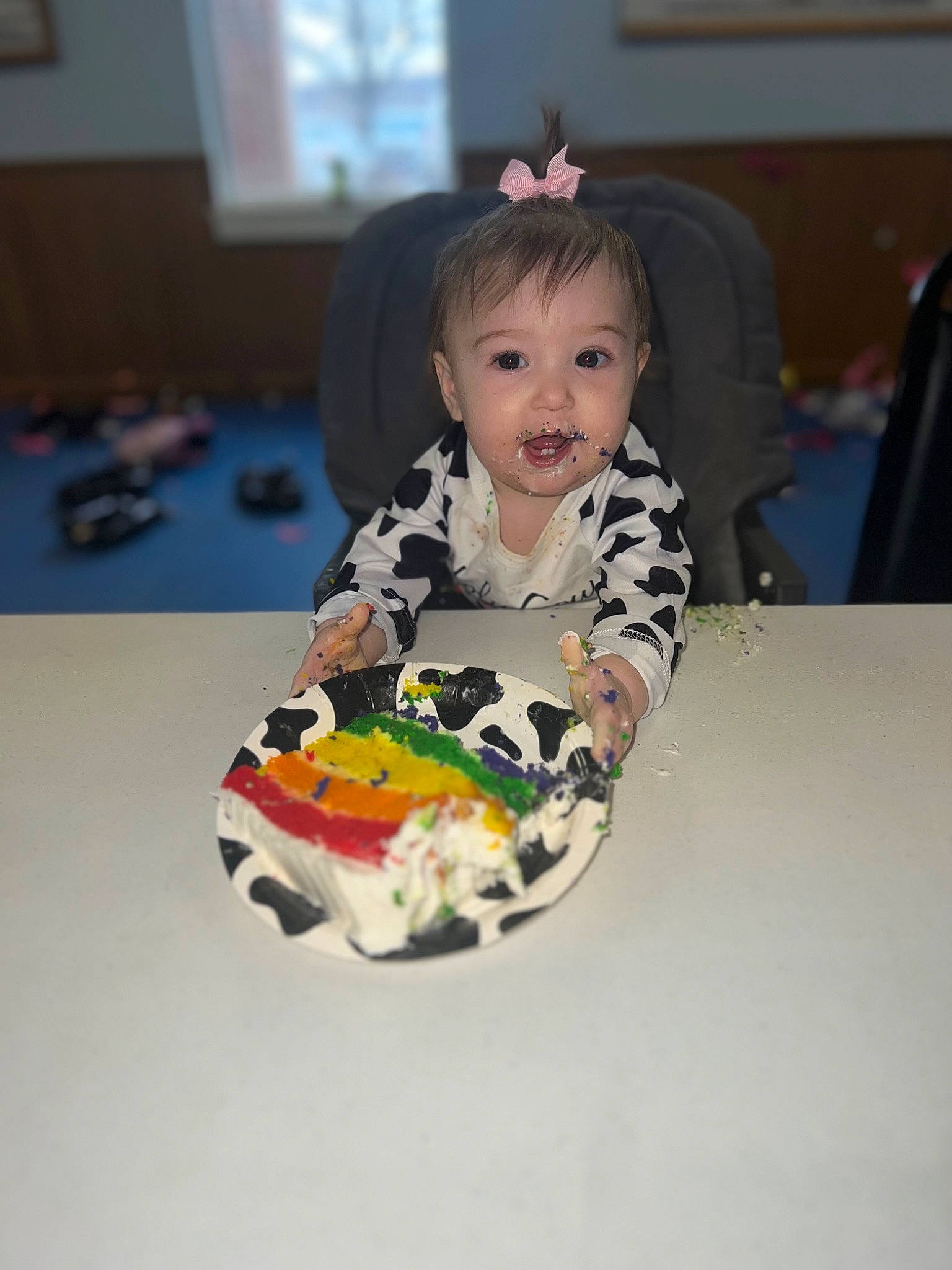 Elora is registered to the contest to win money with this photo: baby, baby_products, baby_toddler_clothing, baby_toys, ball, chair, child, flooring, football, fun, happy, leisure, person, personal_protective_equipment, play, room, sitting, smile, sports_equipment, table