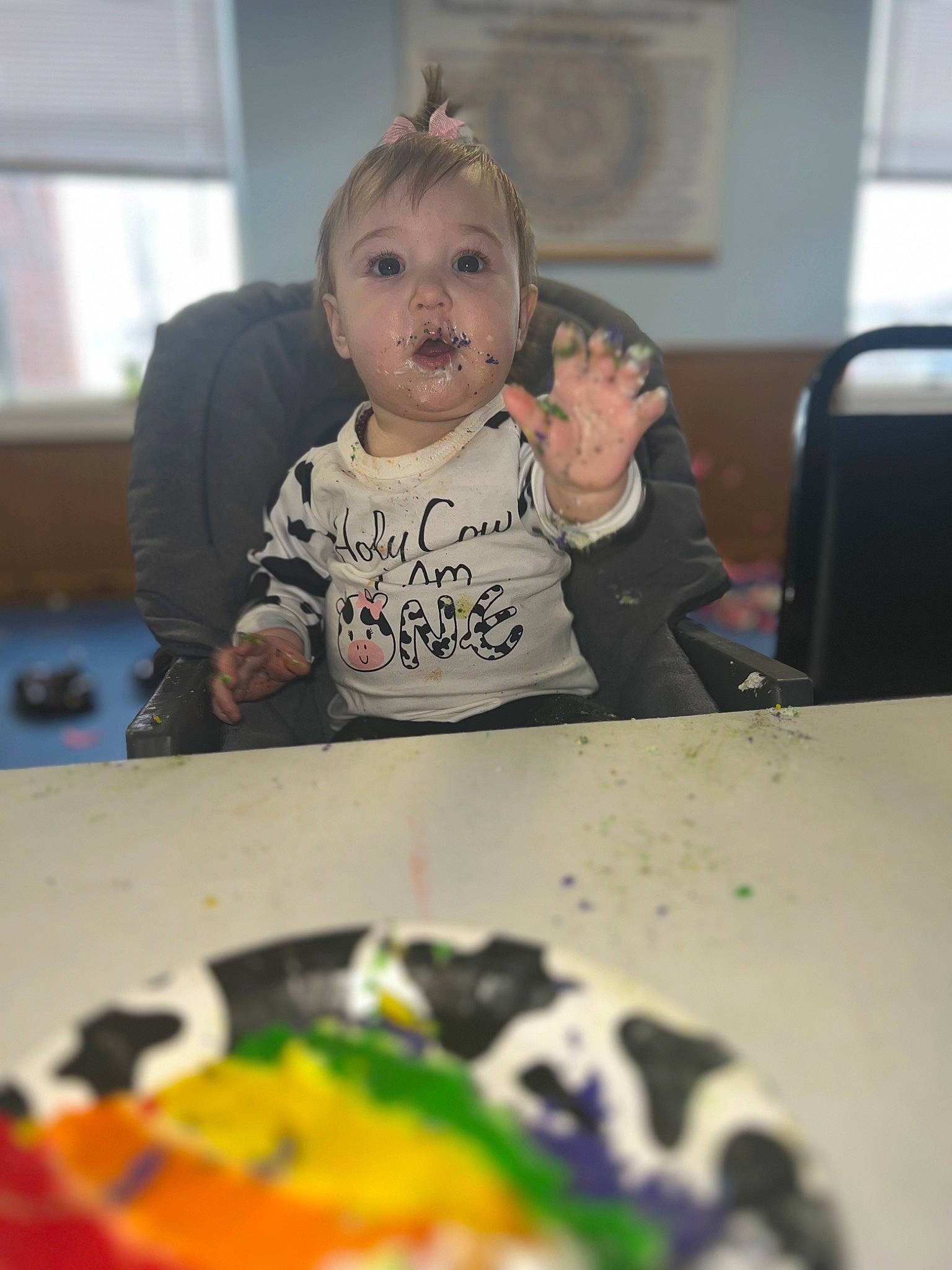 Elora is registered to the contest to win money with this photo: art, baby, chair, child, comfort_food, desk, eating, event, fun, person, plate, room, sitting, sweetness, t_shirt, table, toddler, visual_arts