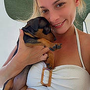 Artemis participe au concours pour gagner de l'argent avec cette photo : woman, puppy, dog, pet, smile, face, hand, bikini, summer, outdoor, canopy, skin, light, closeup, young_adult, animal, cute, happy, holding, vacation