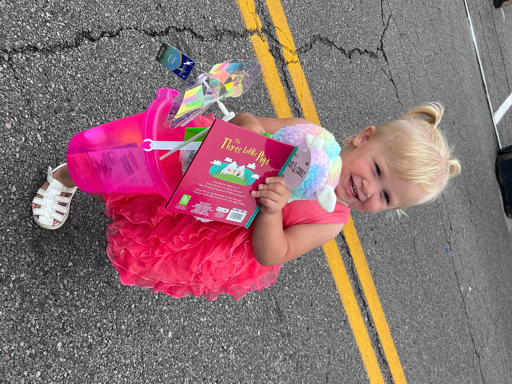 Jolene joined the competition — help win amazing prizes! asphalt, baby, baby_toddler_clothing, child, city, event, fun, grass, joy, leisure, magenta, person, pink, recreation, road, road_surface, sidewalk, sitting, street, tar