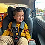 Eduard joined the competition — help win amazing prizes! child, car_seat, seatbelt, yellow_sweater, gap_logo, tongue_out, car_interior, window, daylight, road, vehicle, mischievous, happy, person, casual_clothing, curly_hair, safety, transport, young_child, portrait
