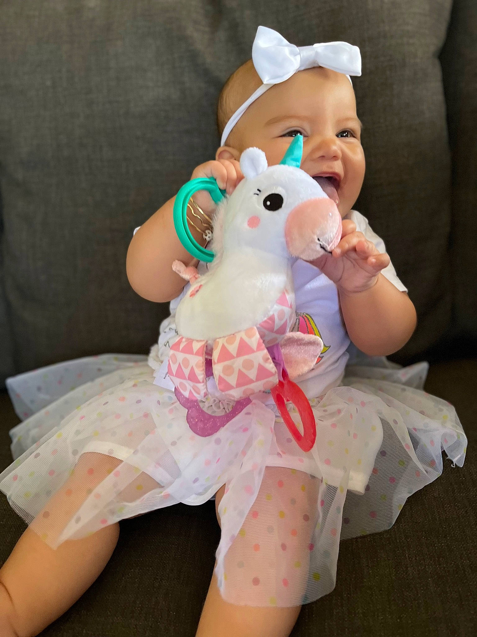 Tyslen Key joined the competition — help win amazing prizes! baby, baby_toddler_clothing, child, dress, event, fictional_character, finger, fun, fur, gesture, hand, happy, mythical_creature, person, pink, plush, skin, smile, stuffed_toy, toddler