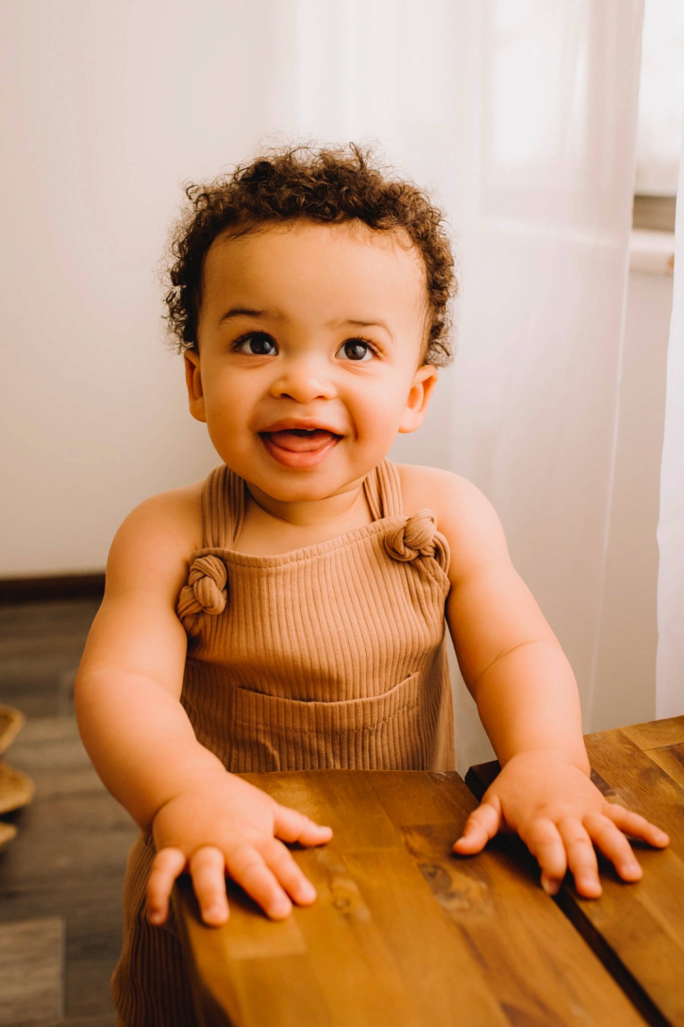 Desmond is registered to the contest to win money with this photo: arm, baby_toddler_clothing, cheek, dress, facial_expression, finger, flash_photography, floor, flooring, hand, happy, joint, joy, neck, person, shoulder, skin, sleeve, smile, standing