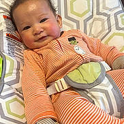 Joseph G joined the competition — help win amazing prizes! baby, baby_chair, child, cozy, cute, face, gloves, happy, head, human, indoor, infant, onesie, orange_clothing, patterned_fabric, seatbelt, smiling, striped_clothing, toddler, young