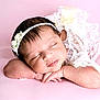 baby, sleeping, infant, headband, flower, white_lace, pink_background, peaceful, resting, cute, soft, portrait, newborn, child, hands, face, closed_eyes, skin, young, adorable