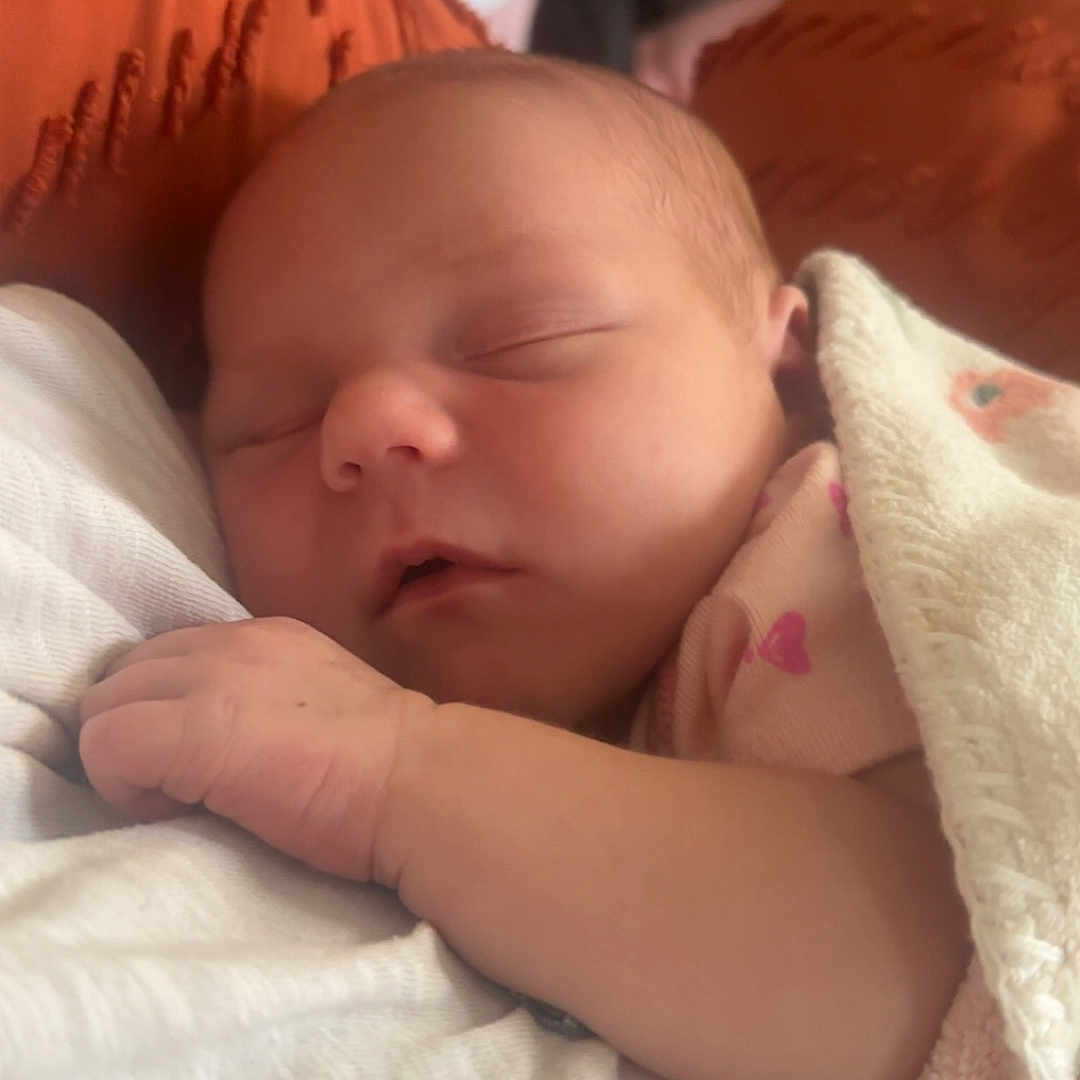 Nyx-Hemera joined the competition — help win amazing prizes! baby, blanket, closeup, comfort, cozy, cushion, face, hand, indoors, infant, newborn, orange, peaceful, person, portrait, resting, skin, sleeping, soft, toddler