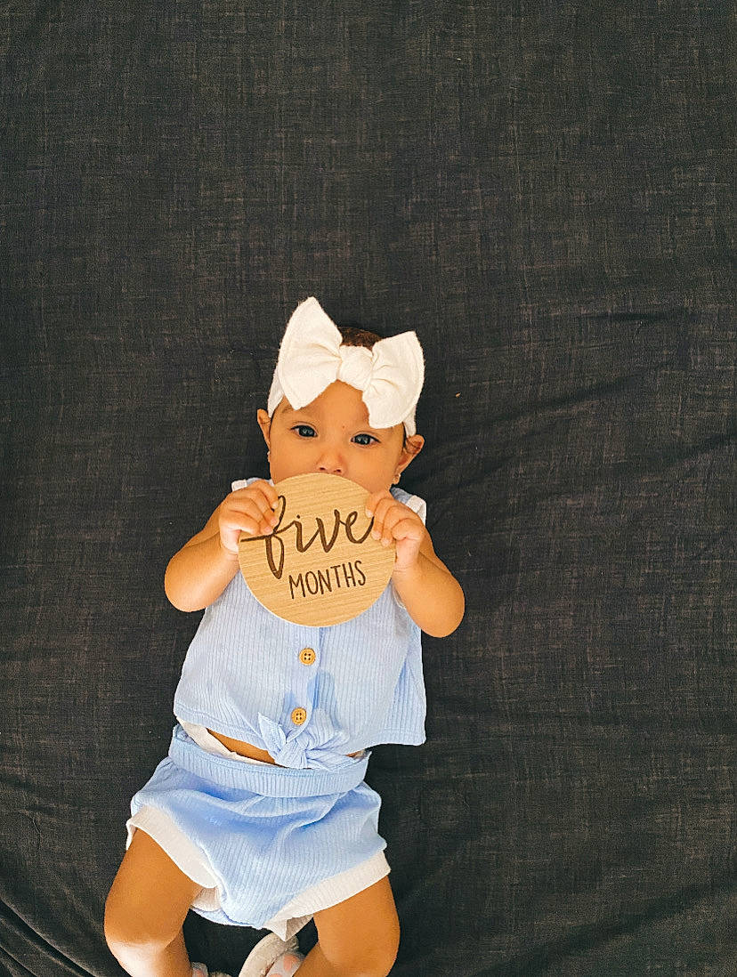 Janaya joined the competition — help win amazing prizes! abdomen, baby_toddler_clothing, baseball_cap, cap, costume_hat, doll, elbow, font, gesture, hat, headwear, human_leg, knee, person, shorts, sleeve, stuffed_toy, t_shirt, thigh, thumb