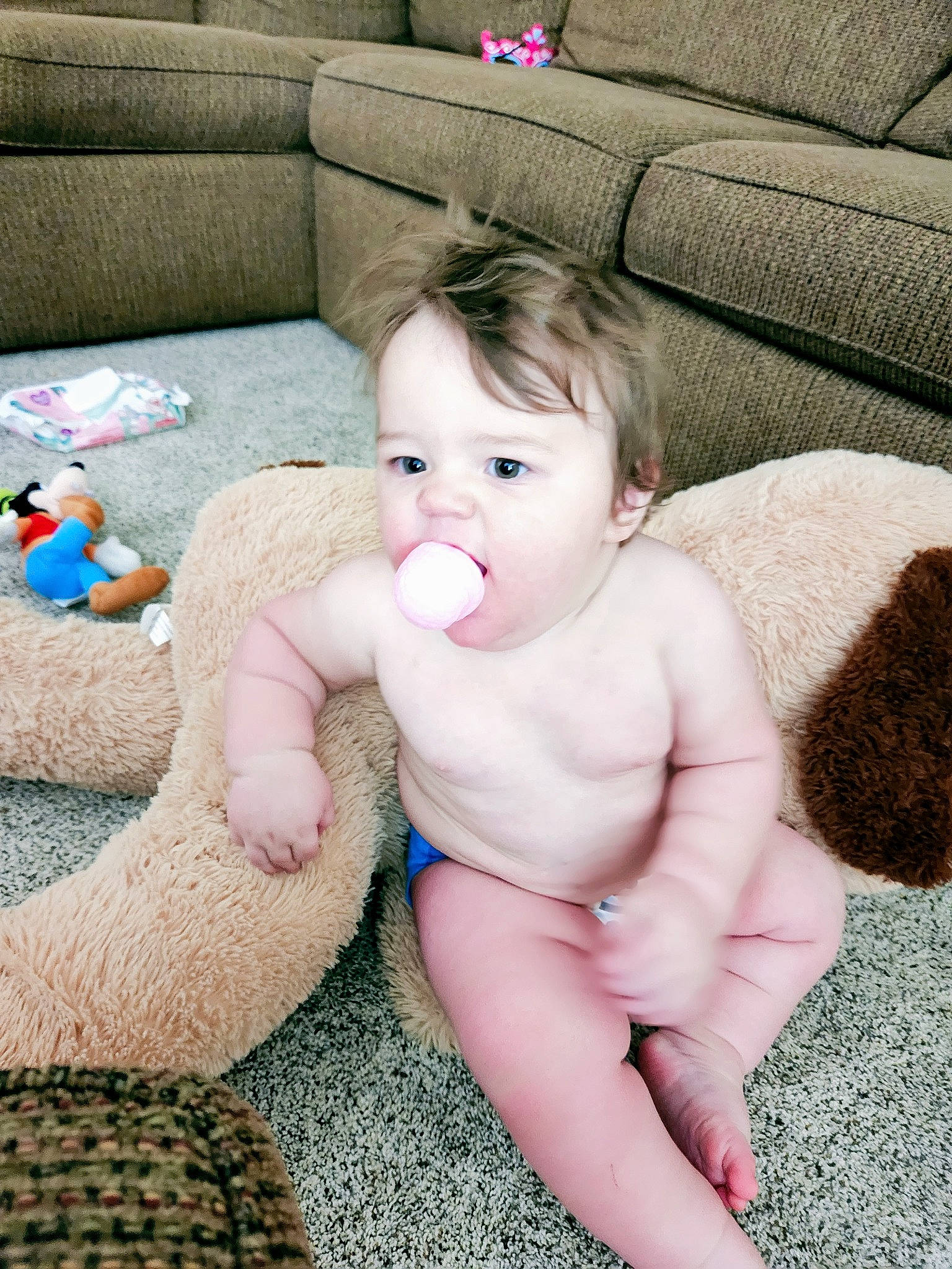 Joe is registered to the contest to win money with this photo: baby, baby_toddler_clothing, cheek, chest, comfort, couch, eye, face, finger, flooring, foot, grass, happy, head, human_body, person, pink, thigh, thumb, toddler